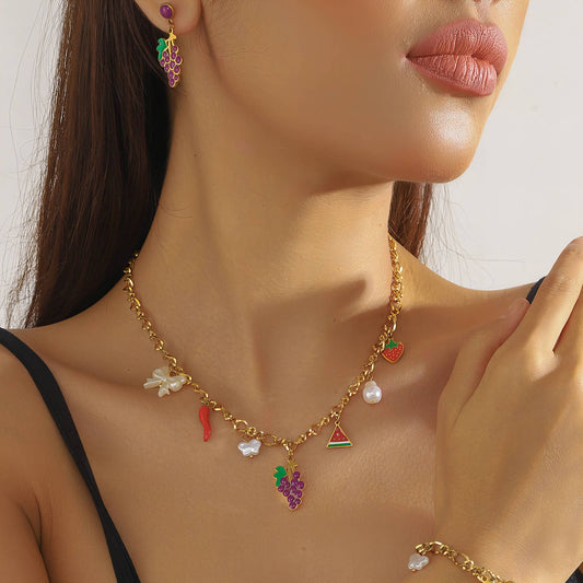Necklace with colorful fruit-shaped charms worn by a model